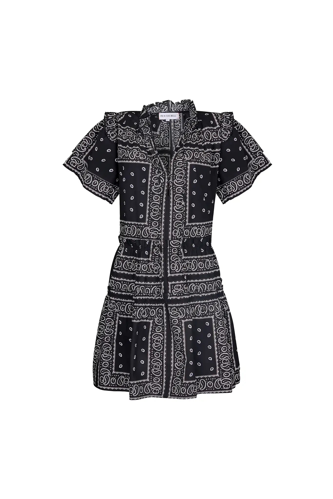 The Merritt Dress has a swing silhouette, ruffle detailing along the V-neck, and a tiered bodice.