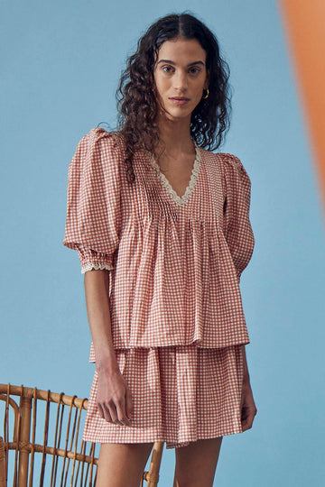 The Jemma smocked waist shorts feature an elastic waistline, hidden side pockets, and a flowy fit.