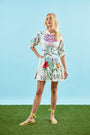 A mini dress with colorful print, front-buttons, mandarin collar, and elbow length sleeves with ties.