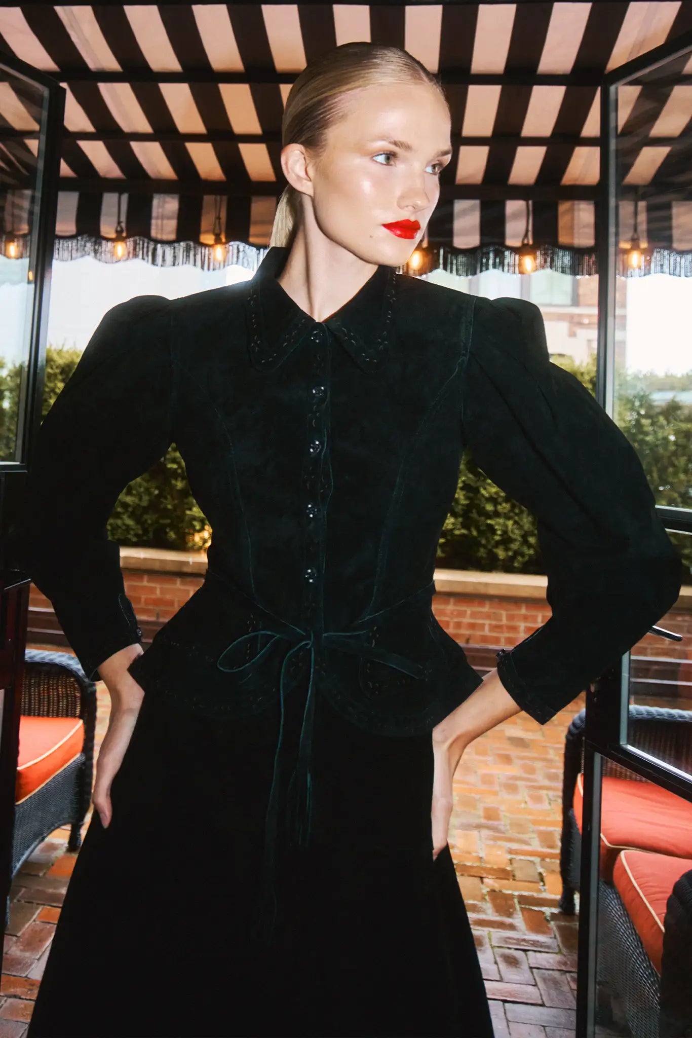 The Murphey Jacket has a button front, long sleeves with button cuffs, and a waist cinched by a belt