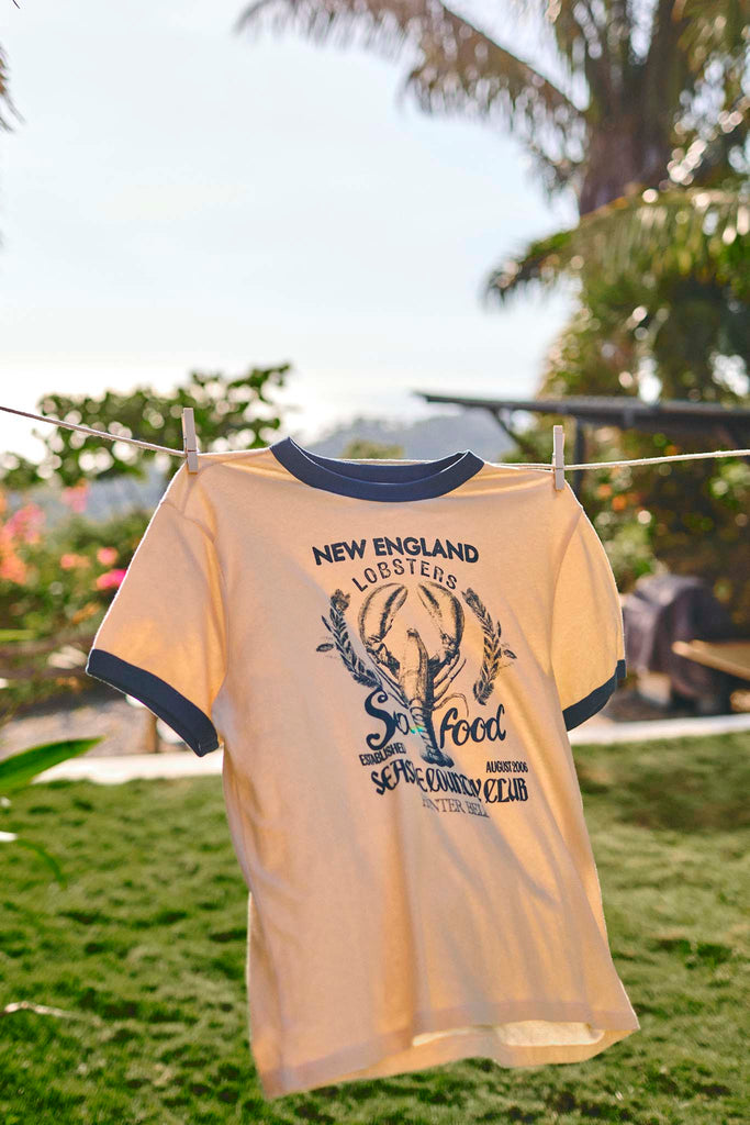 The New England Tee is a ringer-style crew neck with a playful New England lobster crest.