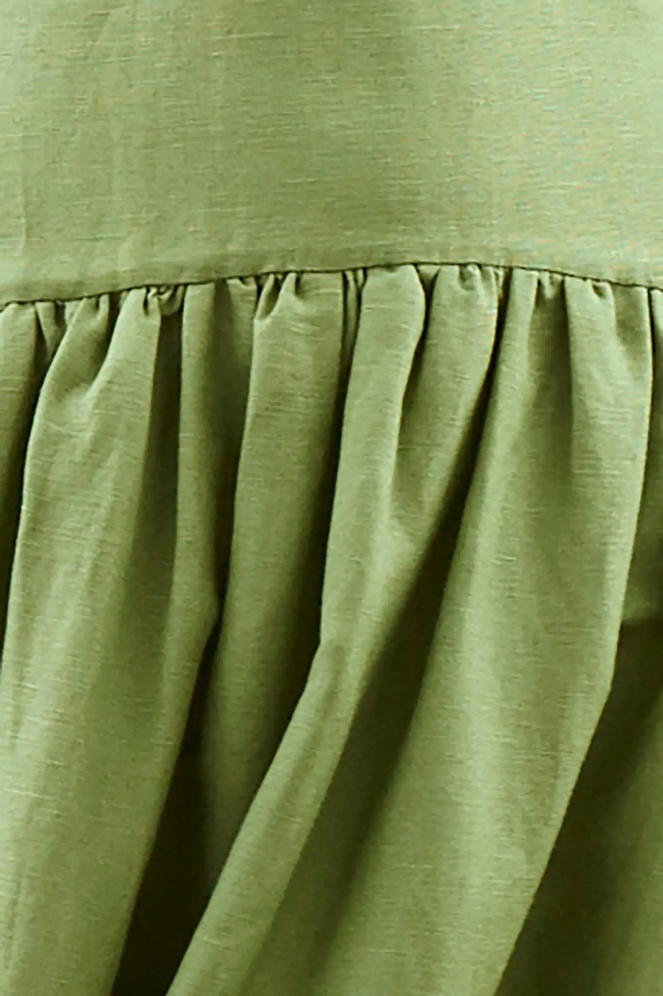 Close up of the Newberry Dress, spaghetti strap linen midi dress, in Glass Green.