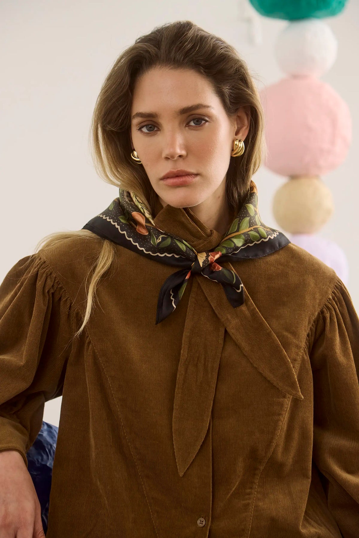 The Odessa Shirt in Khaki paired with the Suki Skirt in Found Heirloom and matching scarf. 