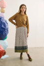 Opal Sweater and Dominic Skirt in Thistle and Vine.