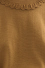 Close up of the opal sweater in Chestnut.