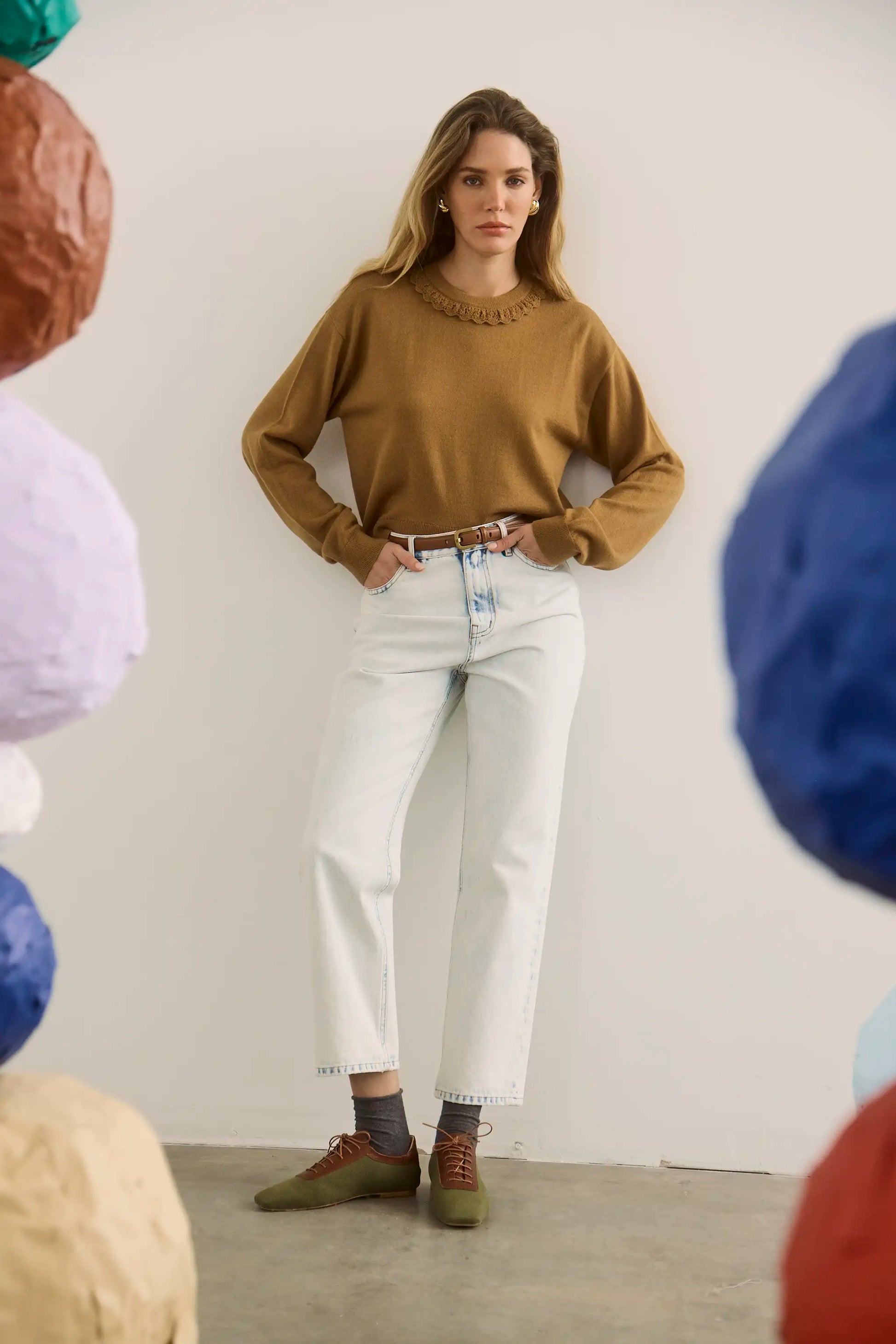 The Opal Sweater in Chestnut paired with the Wray Pant in washed blue denim. 