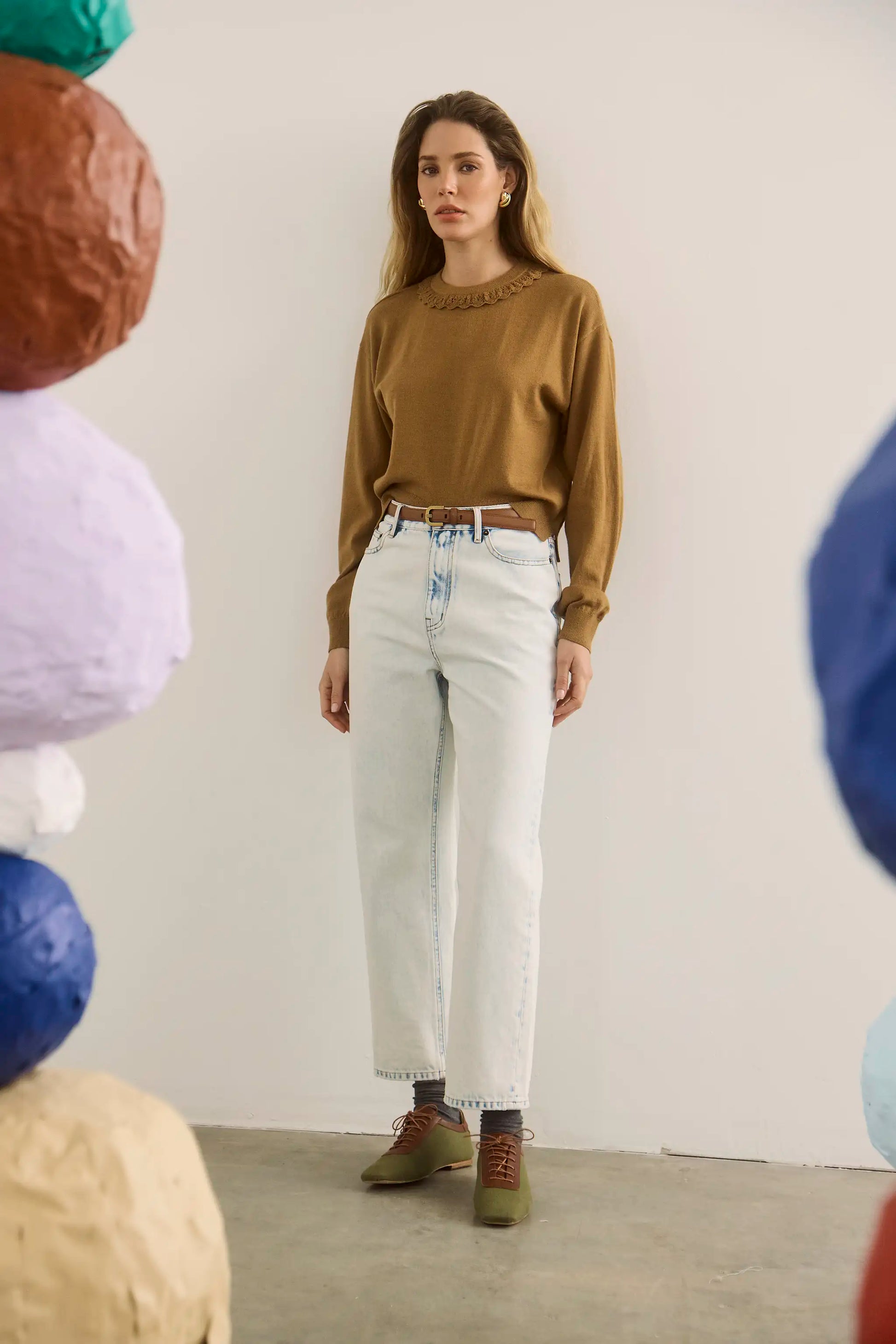 The Opal Sweater in Chestnut paired with the Wray Pant in washed blue denim. 