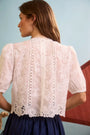 The back of the Ouisie Top paired with Allegra Skirt in Deep Sea. 