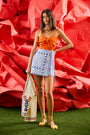The Bay Skirt in blue and white stripe paired with Pearl Top in Tangerine Tango and Callen Cardigan.