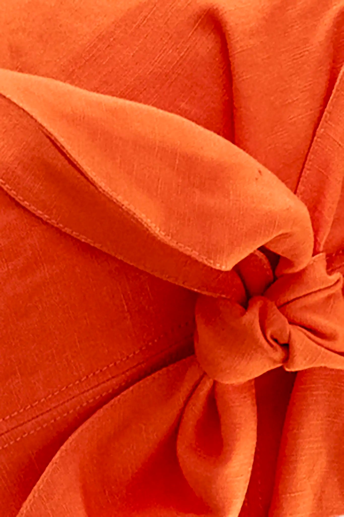 Close up of The Pearl Top in Tangerine Tango 