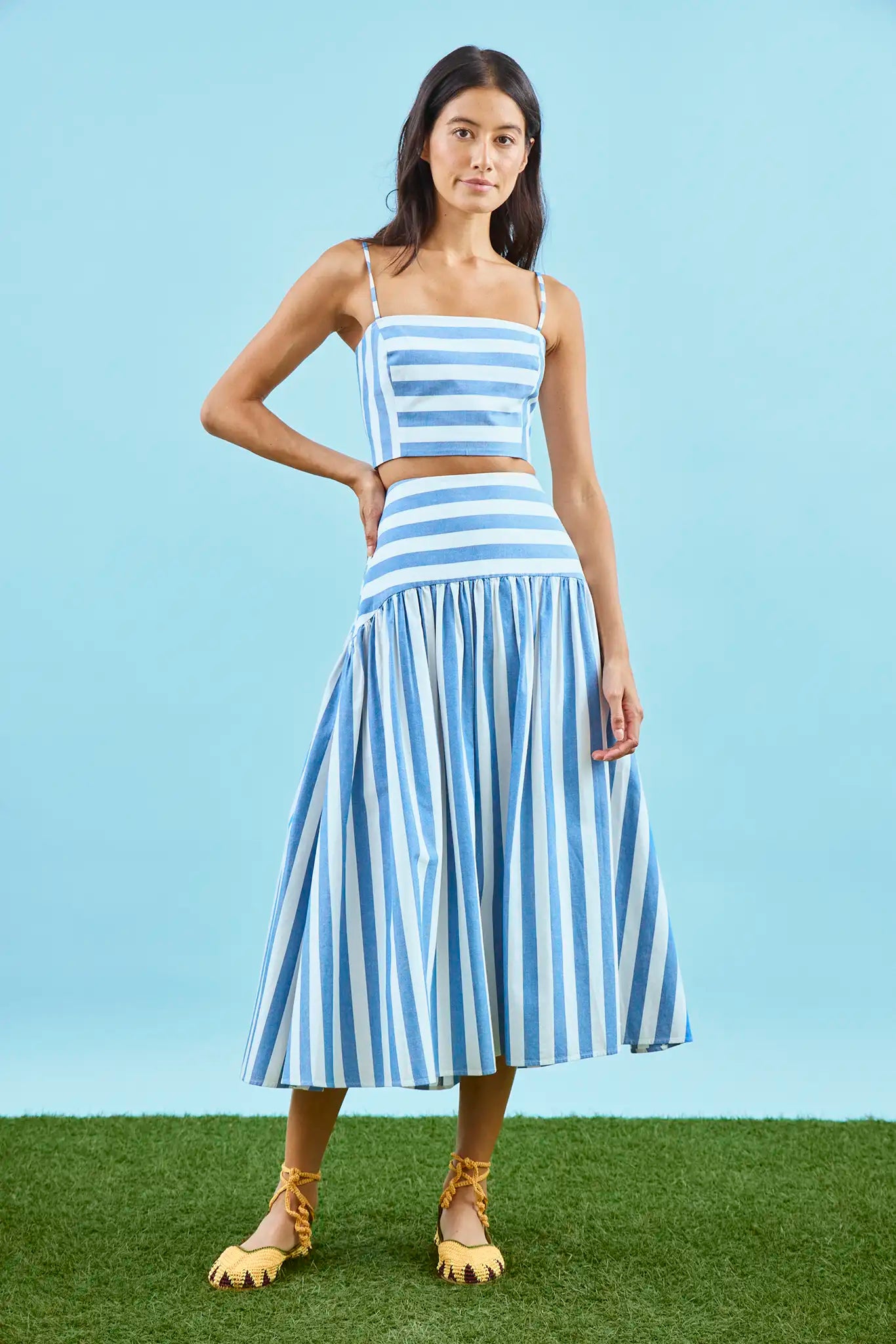 The Alyssa Midi Skirt paired with matching pepper top in blue and white stripe on model.