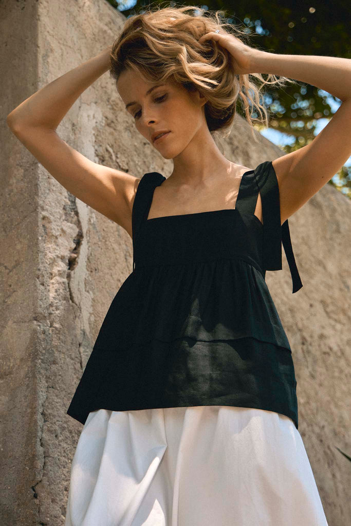 The Pruett top has self tie straps and an empire waist with tiered panels for a flowy silhouette.
