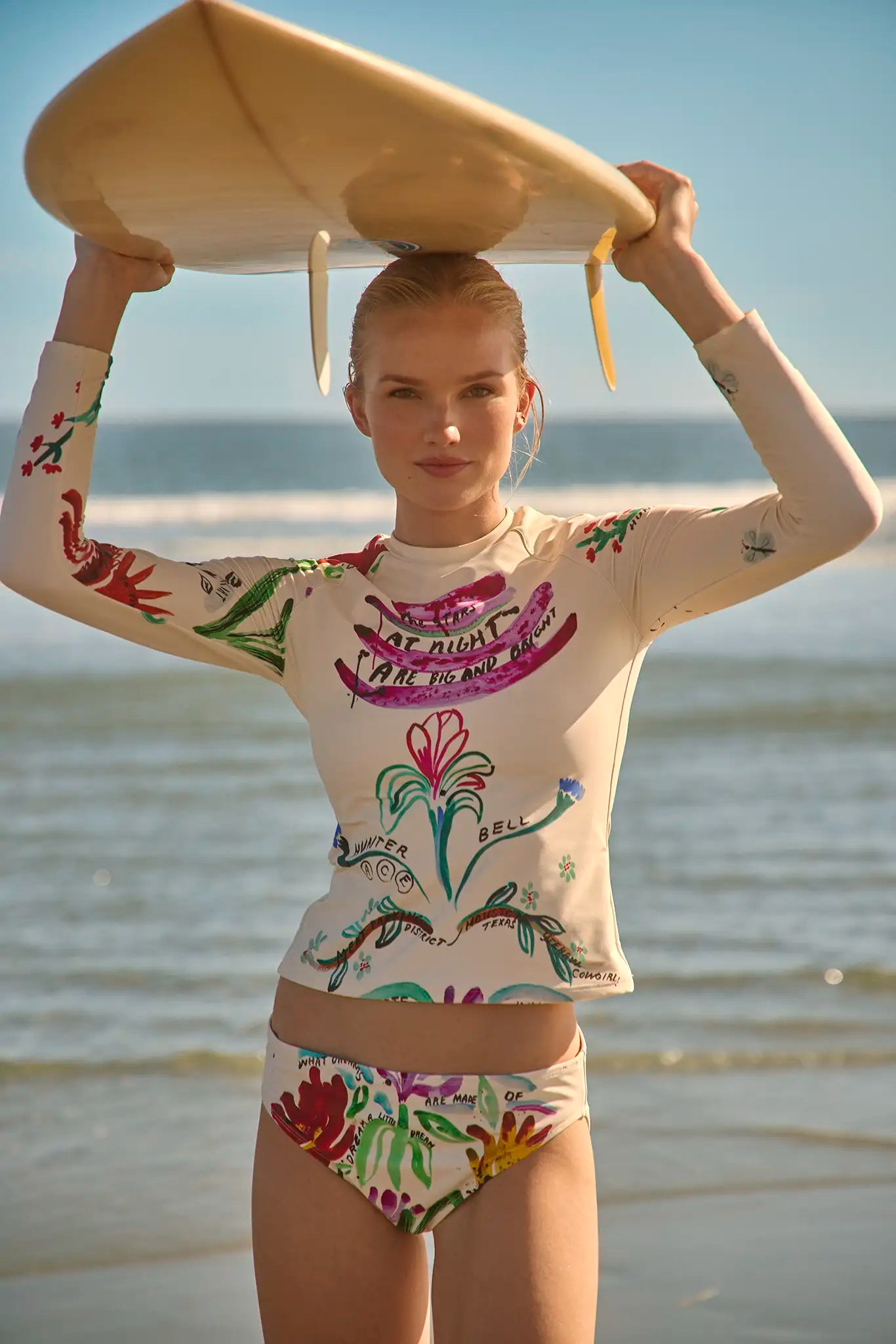 A long sleeve rash guard in our custom anniversary print.