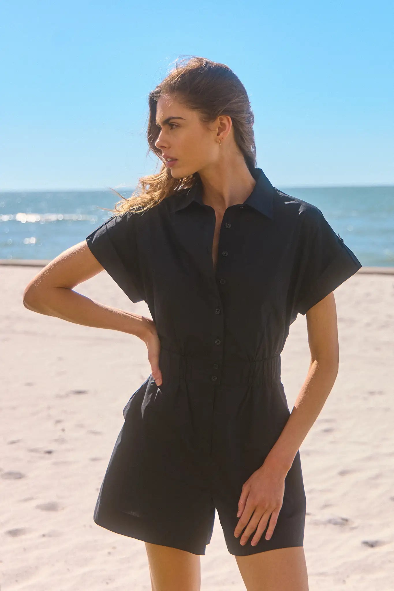 The Reed Romper has short sleeves with banded cuffs, an elastic waistband, and on-seam pockets.