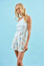 The Catalina Shorts in falling blossom print paired with our Rhode Tank in White