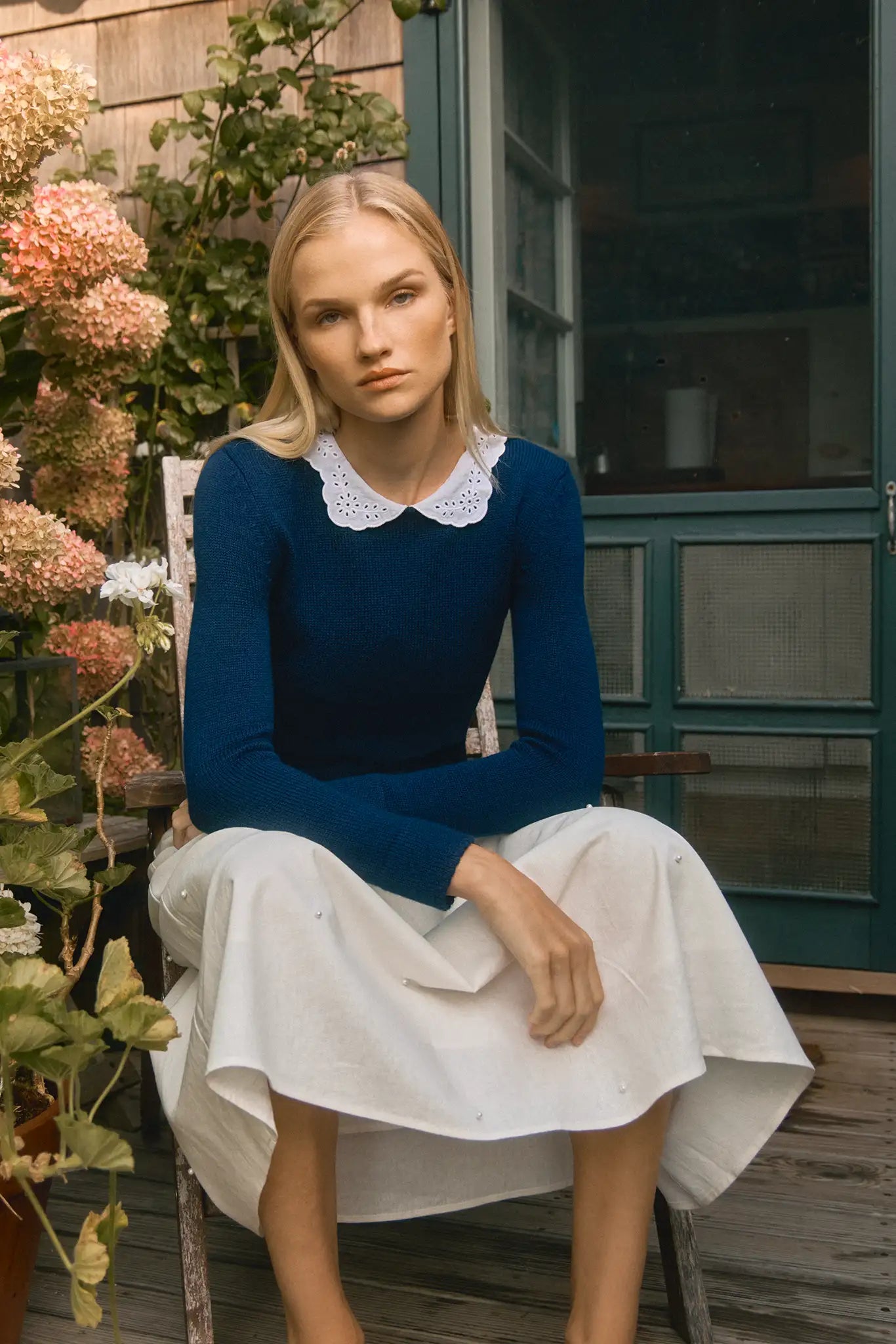 Fitted long-sleeve sweater with a delicate lace-look and eyelet-detailed collar. 