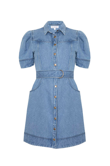 The Robinson denim dress has paneled seams, a shirttail hem, and snap a front closure.