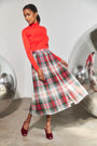 The Roen Turtleneck in Crimson paired with the Harlan Skirt.