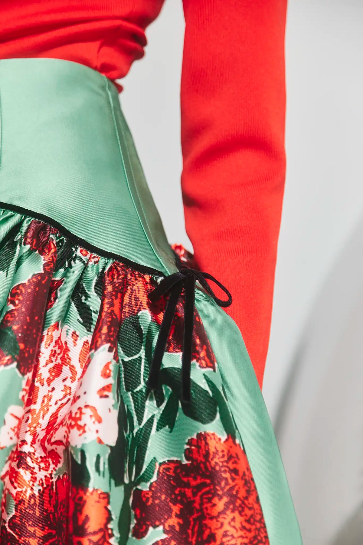 The Nolita Skirt in Evergreen Conservatory paired with the Roen Turtleneck in Crimson Red. 