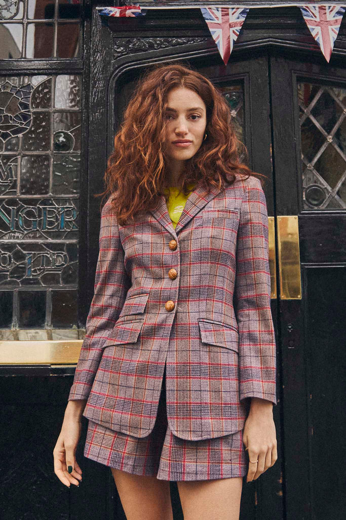 The Anderson plaid blazer has a front button placket, lapel collar, and flat front pockets.