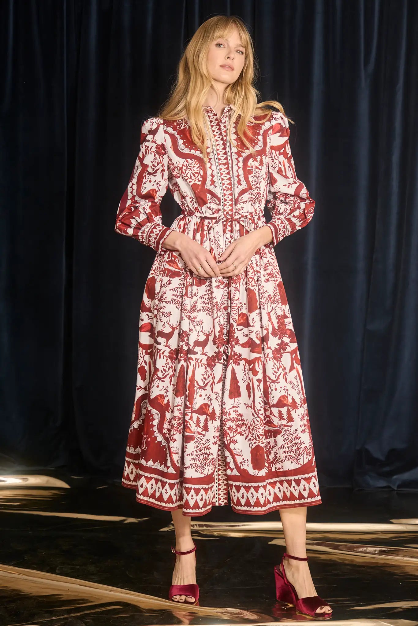 The Rosie Dress is full-length, collared neckline, long sleeve with button cuffs, & drawstring waist