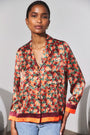 The Roxy Top in Crimson Blossom paired with denim. 