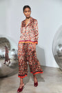 The Roxy Top in Crimson Blossom paired with the matching Whisper Pants.