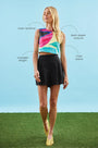 A cropped sleeveless top with a crew neckline and back zipper in our Stroke of Spring print.