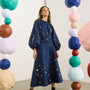 The Ida Skirt in Atelier Splatter Navy paired with the matching Rue Top. 