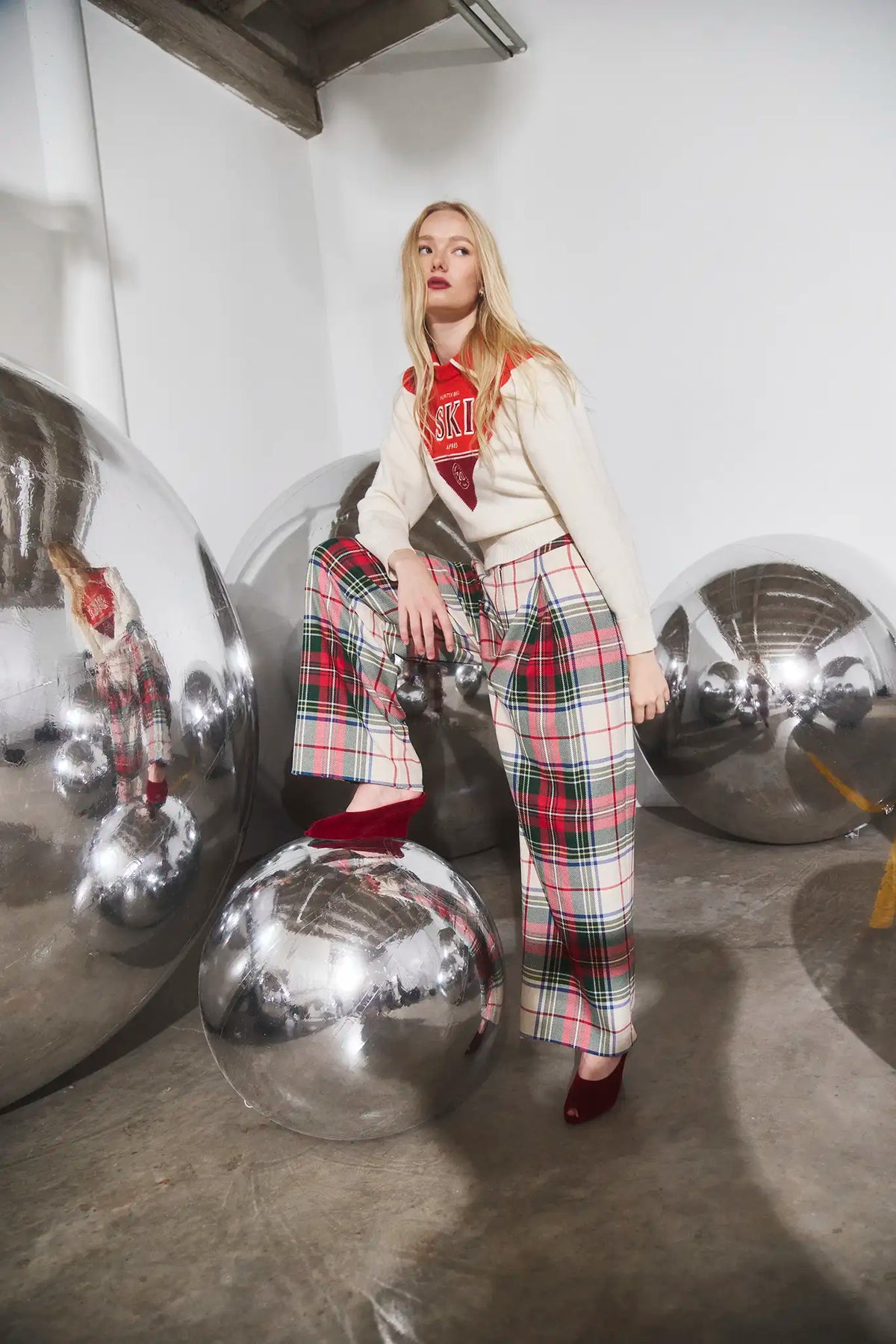 The Ridley Pant in Kensington Plaid Crimson paired with the Ryder Sweater. 