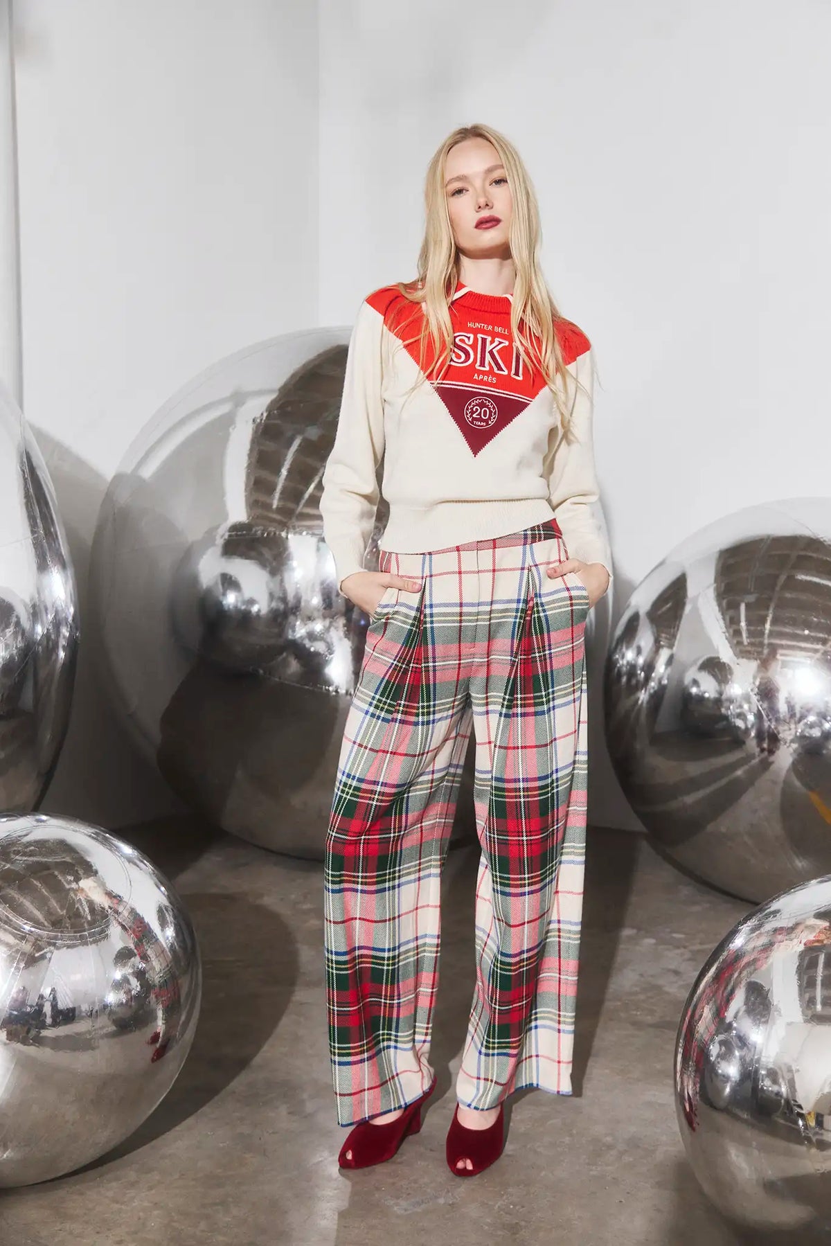 The Ridley Pant in Kensington Plaid Crimson paired with the Ryder Sweater. 