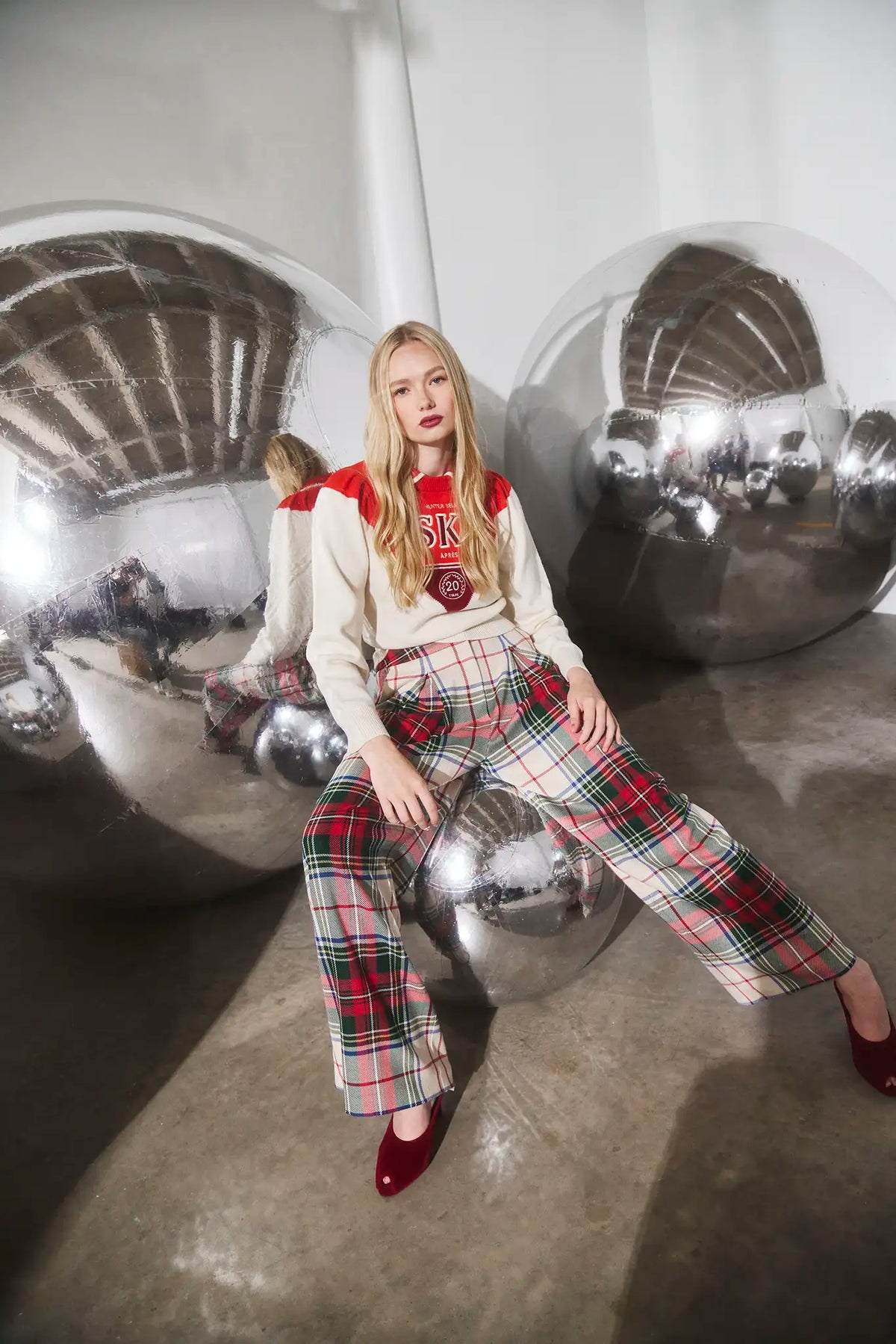 The Ridley Pant in Kensington Plaid Crimson paired with the Ryder Sweater. 