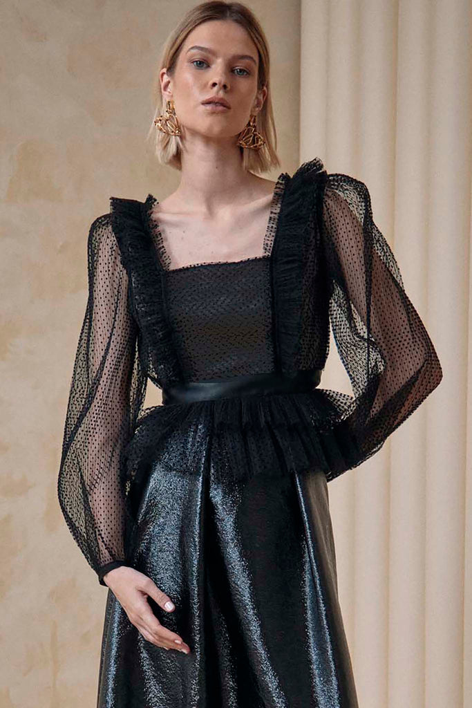 A square neck blouse in pleated flocked tulle with sheer sleeves and cascading ruffles.