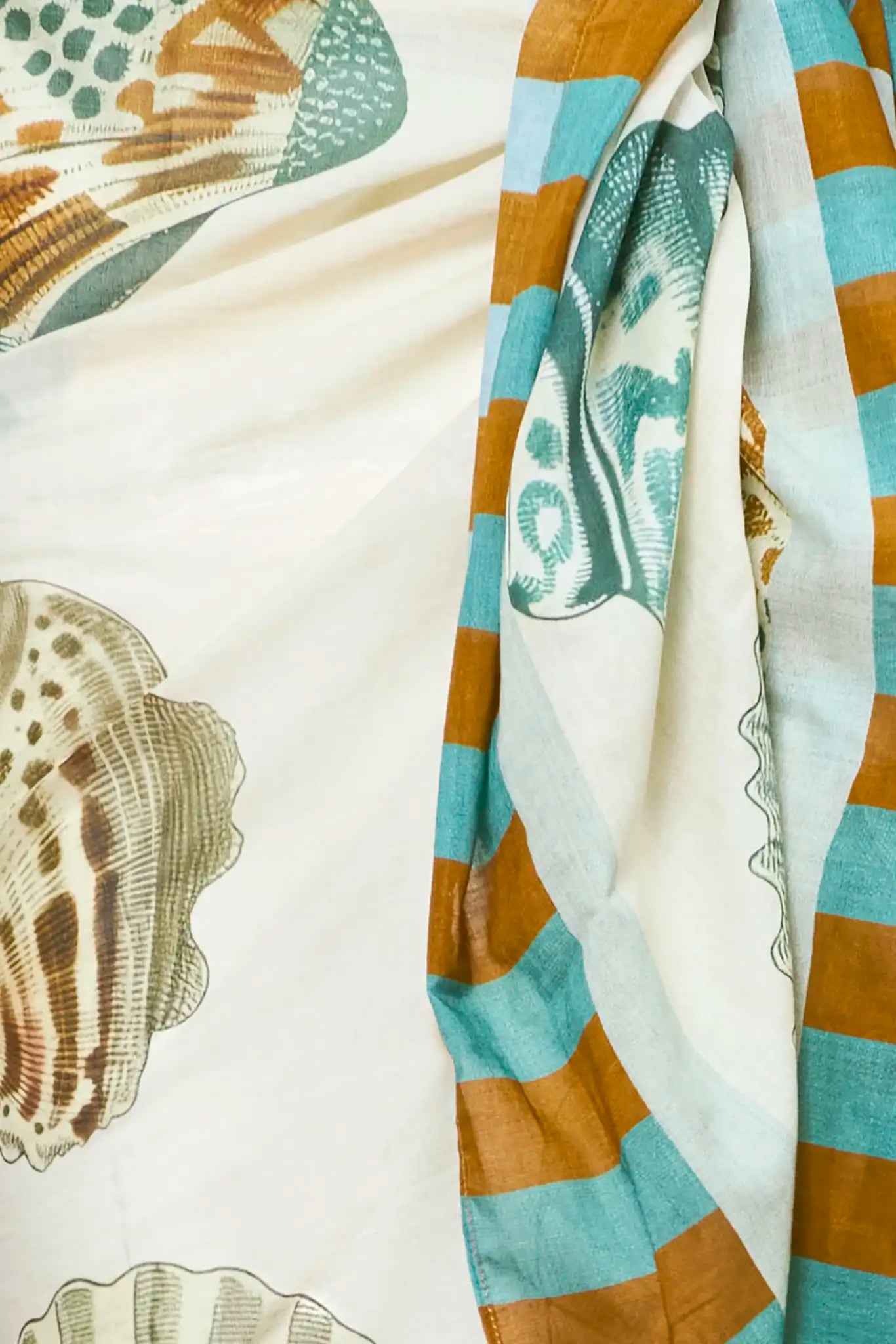 Close up of the sarong in Somers Shell Cream.