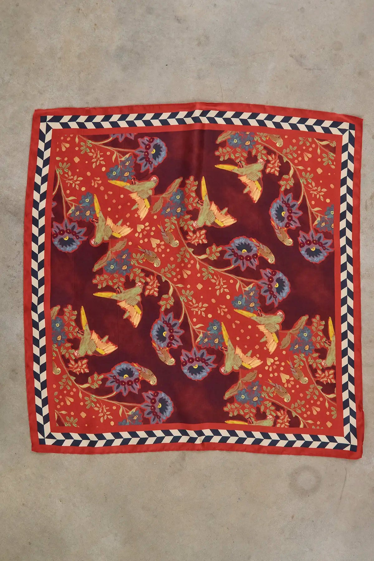 Flatlay of the Scarf in Birds of a Feather Maroon.