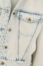 Close up of the Solene Jacket in Washed Blue Denim. 