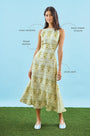Faith Dress in Green Trellis modeled in front of blue wall with call outs.