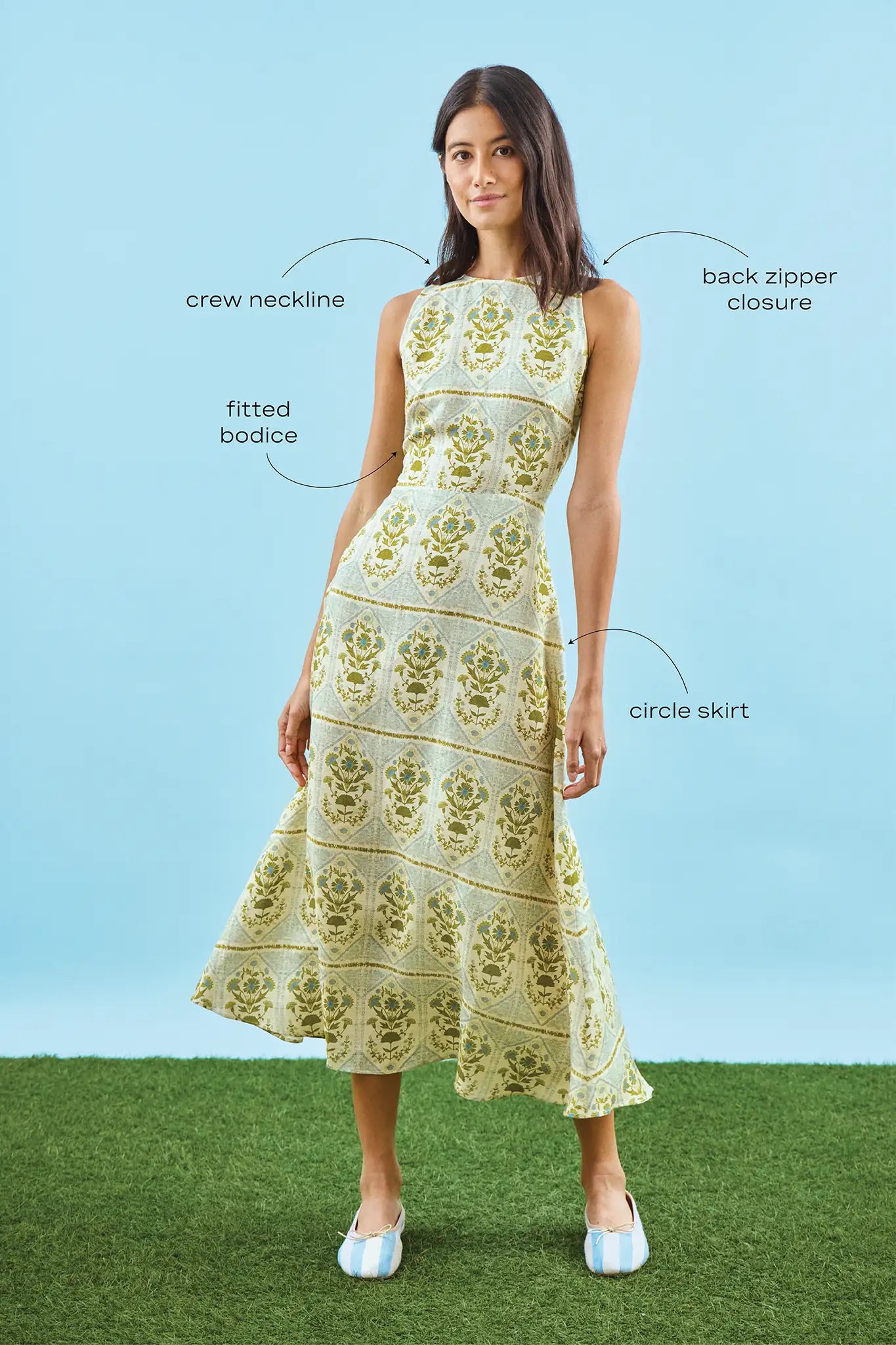 Faith Dress in Green Trellis modeled in front of blue wall with call outs.