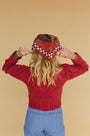 Natalie Steen in the Bobble Sweater and Birds of a Feather Maroon scarf.