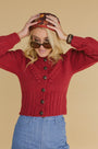 Natalie Steen in the Bobble Sweater and Birds of a Feather Maroon scarf.
