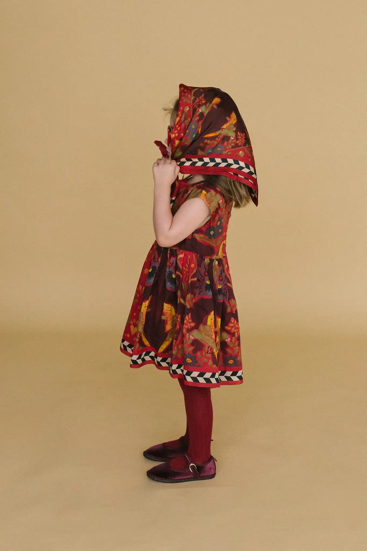 The Kids Piper Dress in Birds of a Feather Maroon. 