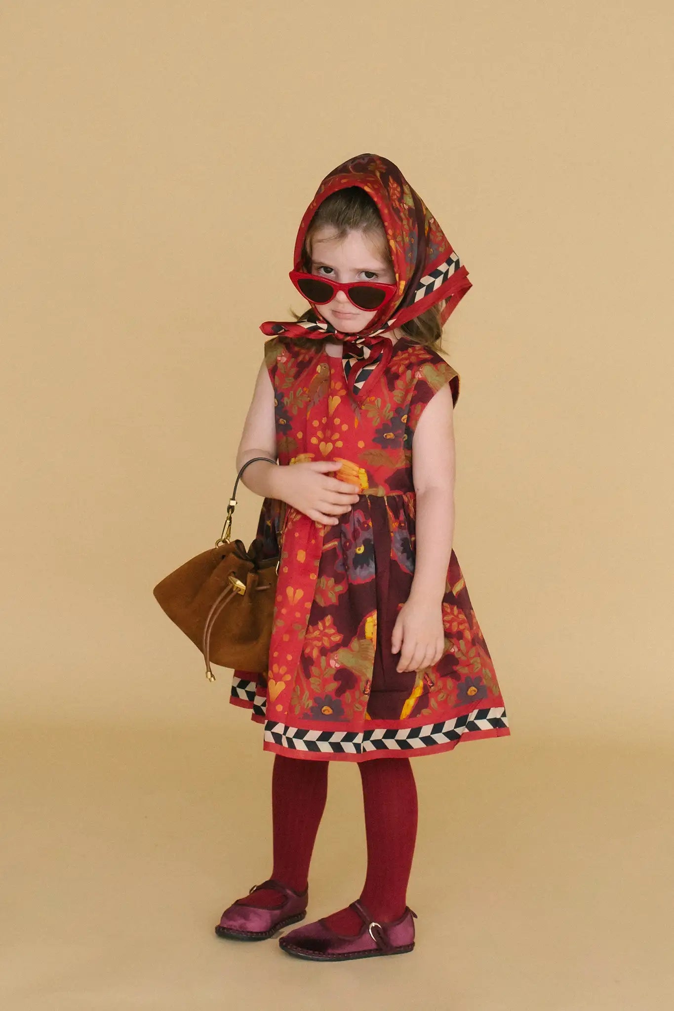 The Kids Piper Dress in Birds of a Feather Maroon. 