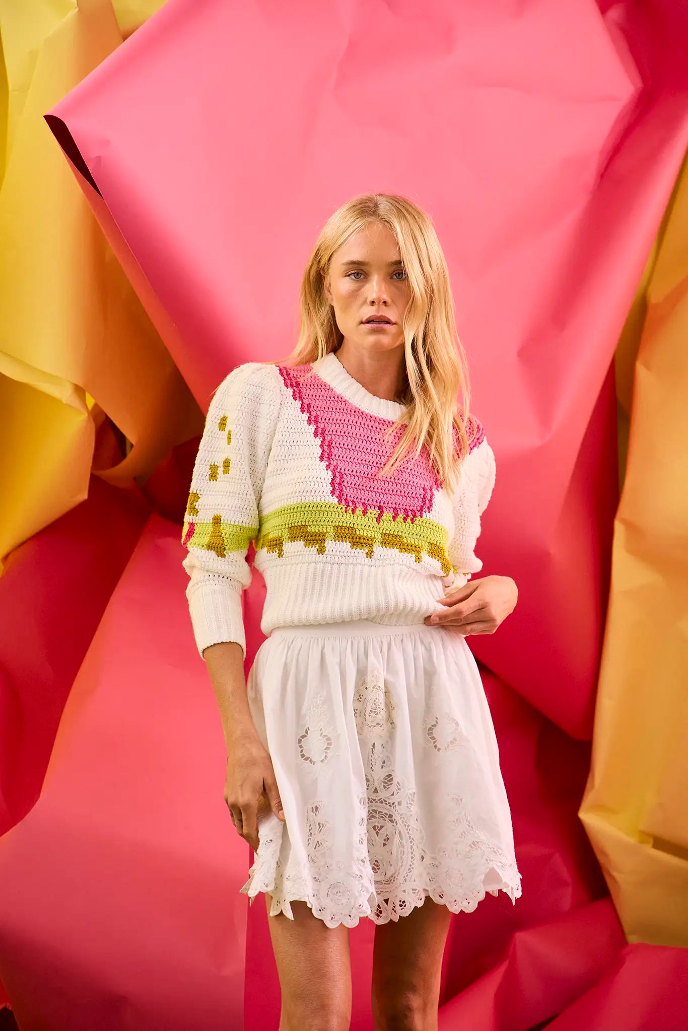 A lightweight crochet sweater in white multi. 