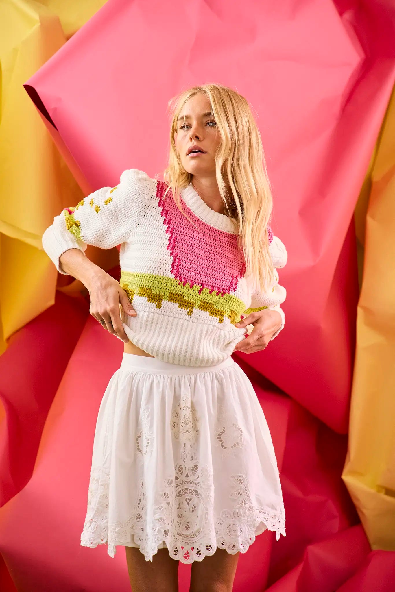 A lightweight crochet sweater in white multi. 