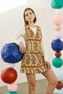 The Suni Dress in Amber Glen Cream paired with the Callie Sweater in Ivory. 