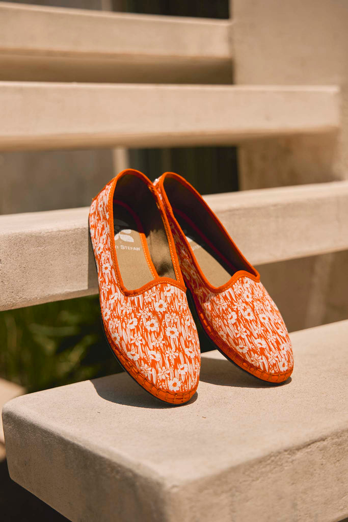 The Nikola Loafer is a hand sewn slipper in a vibrant scarlet lei fabric.