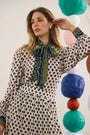 The Tess Blouse in Thistle and Vine Cream paired with the matching Dominic Skirt. 