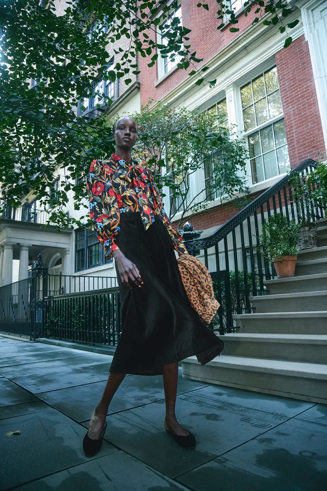 The Atlyn Skirt in Velvet Onyx paired with the Tess Blouse in Palais Floral Onyx.