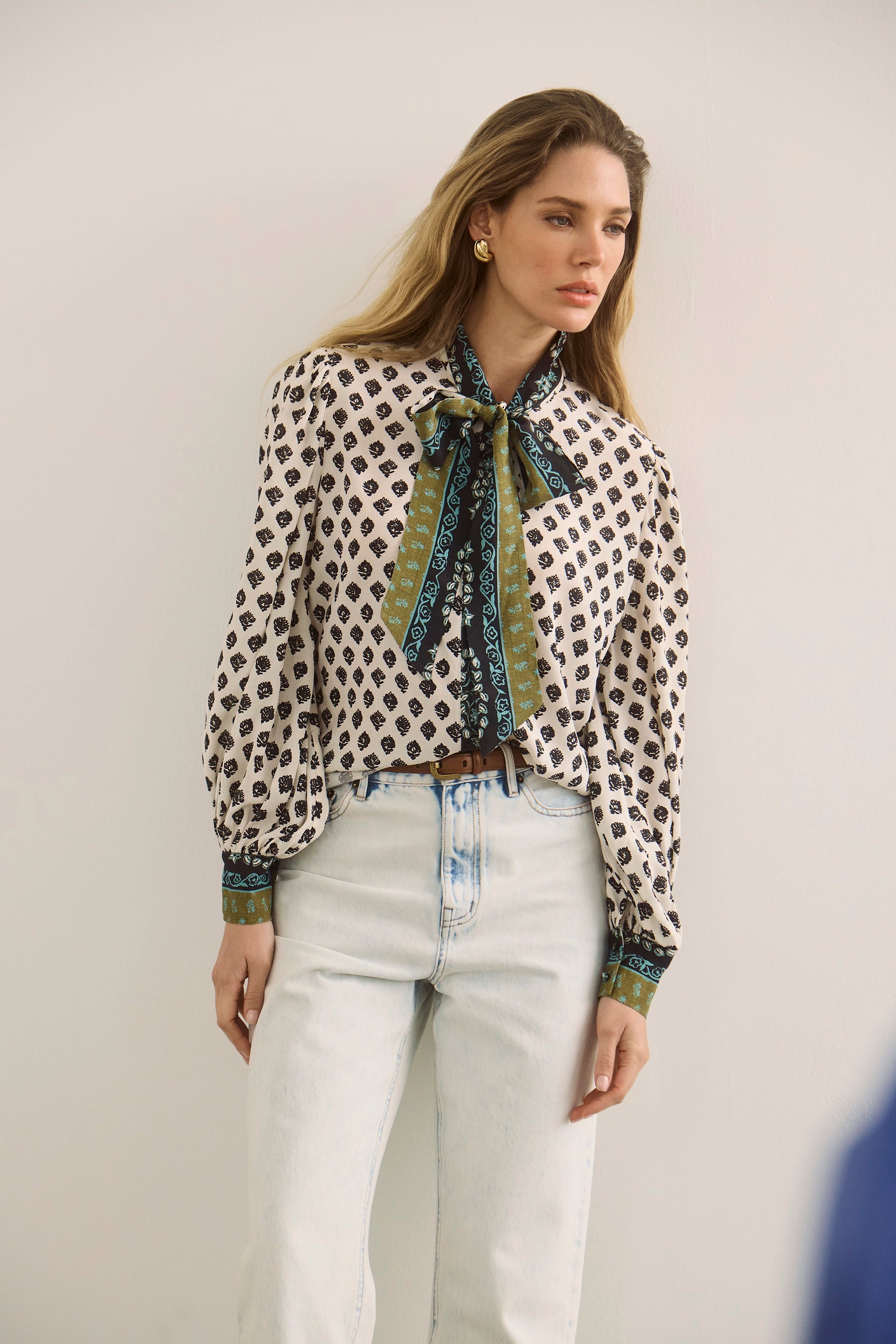 The Tess Blouse in Thistle and Vine Cream paired with the Wray Pant in Blue Washed Denim. 