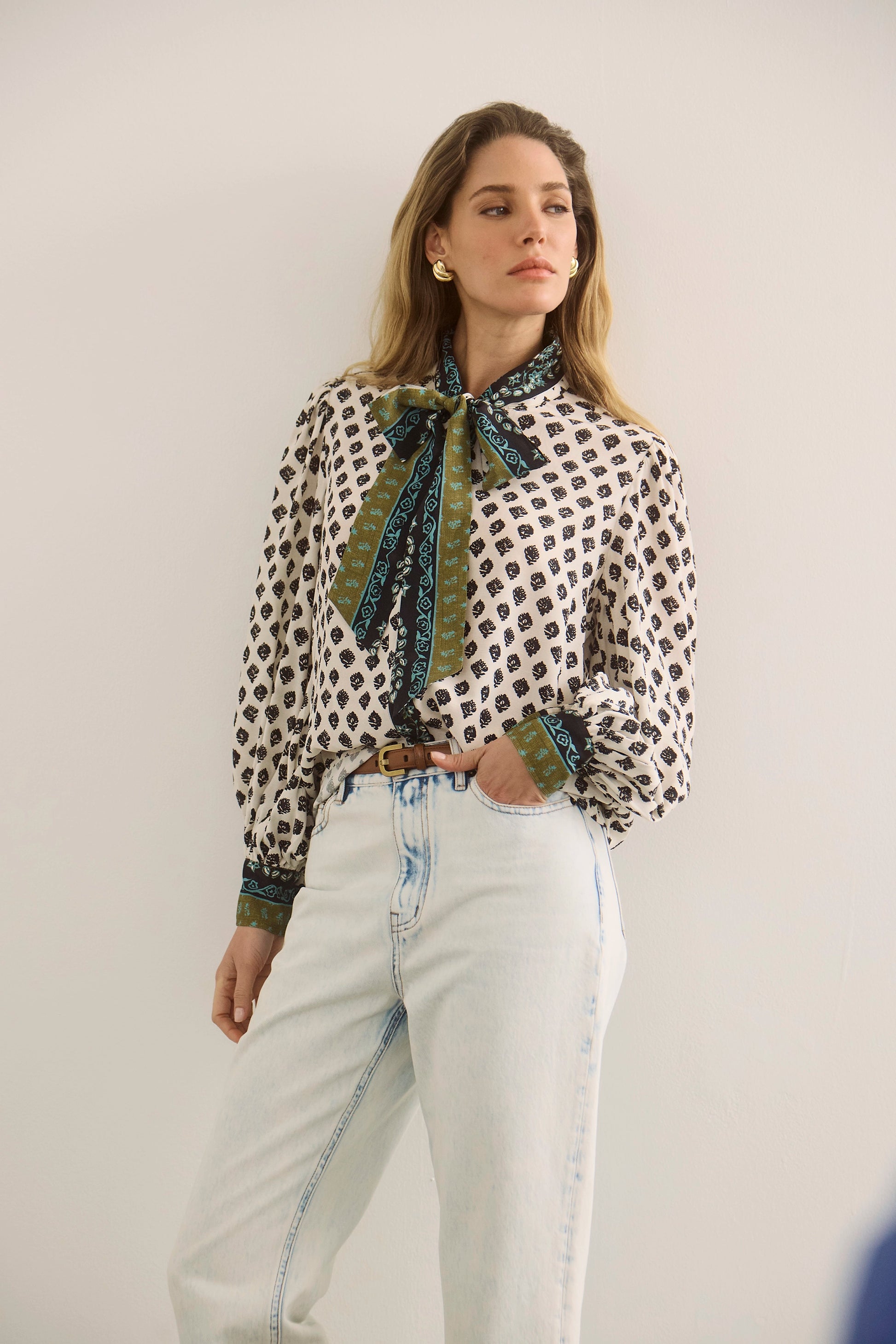 The Tess Blouse in Thistle and Vine Cream paired with the Wray Pant in Blue Washed Denim. 